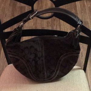 A chocolate Coach purse